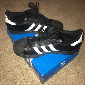 Black Adidas Tubular Viral W sneakers.